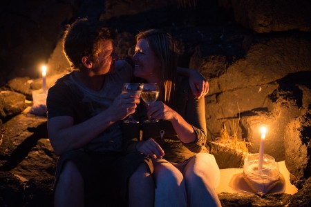 Tom and Anique enjoy a bottle of "bubbly" on the banks of the Zambezi