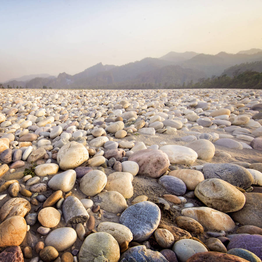 Image of river stones in light on Karnali River