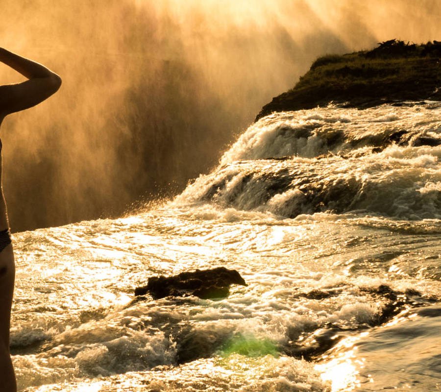 Image of girl looking at Devils Pool on Livingstone Island Zambia