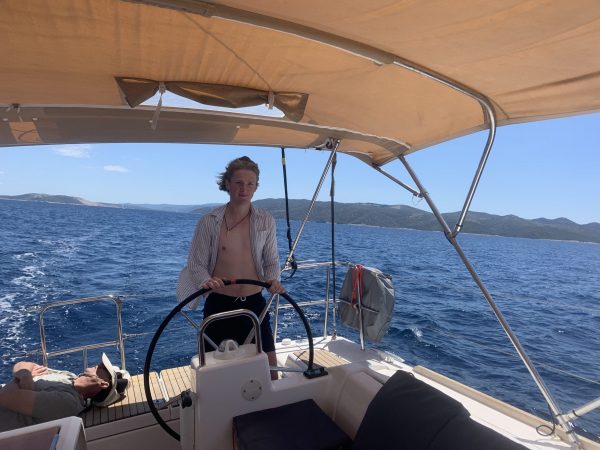 Me at the wheel, sailing in the Croatian Islands