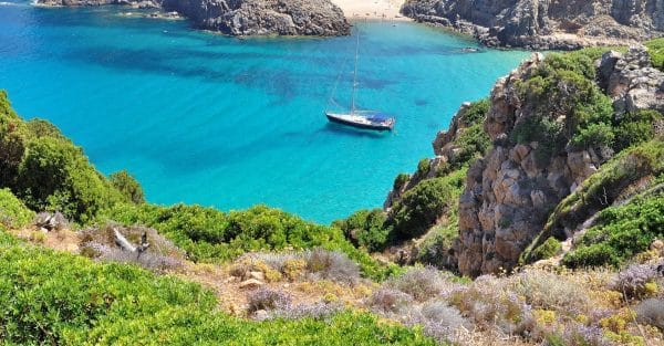 A yacht in a secluded clear water bay